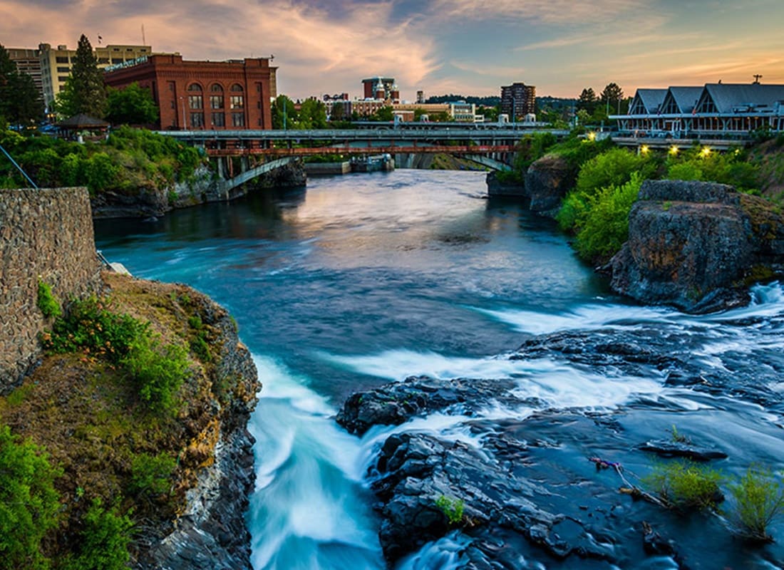 Spokane, WA - Rushing River Flows Under a Bridge in Spokane, WA